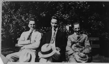 three men on a bench
